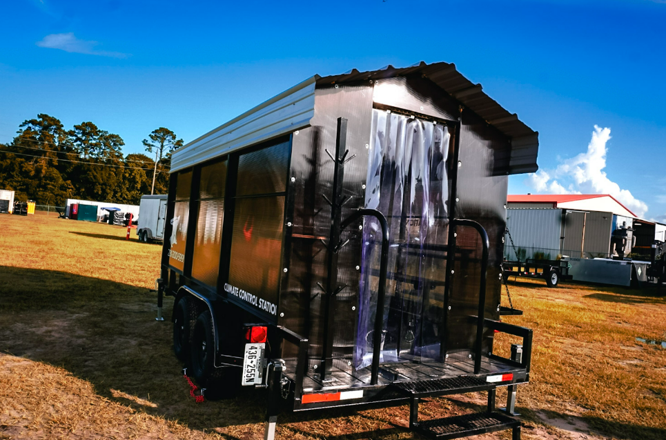 Rear three-quarter exterior view of an Anvil Rentals climate control station trailer staged on a jobsite yard