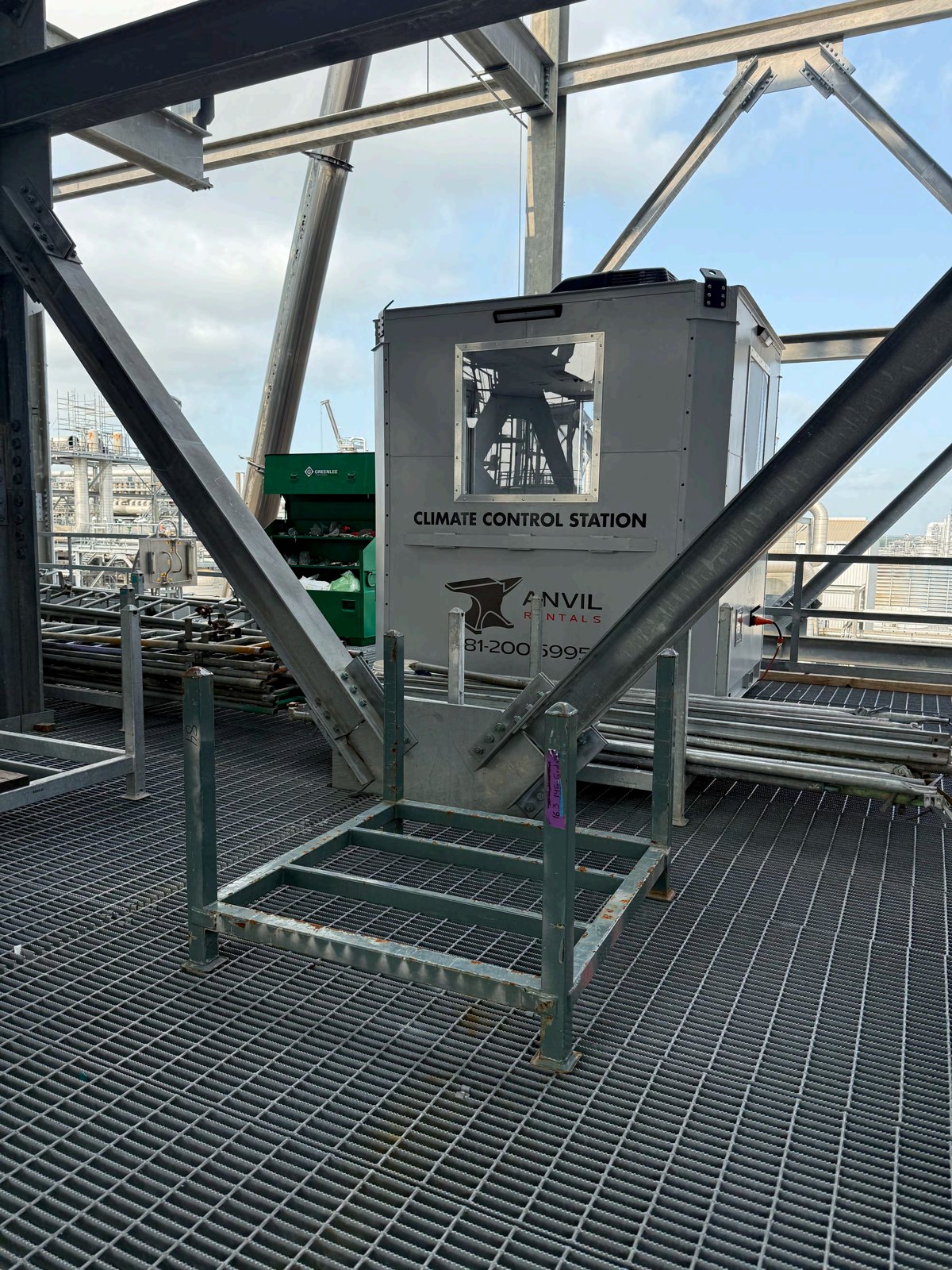 Anvil Rentals climate control station cube unit installed on an elevated industrial structure at a refinery